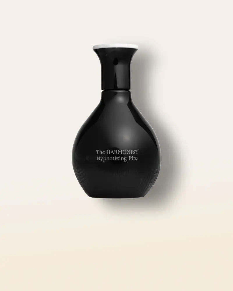 The Harmonist Hypnotizing Fire, a warm, spicy, and sensual fragrance with amber, vanilla, and sandalwood.