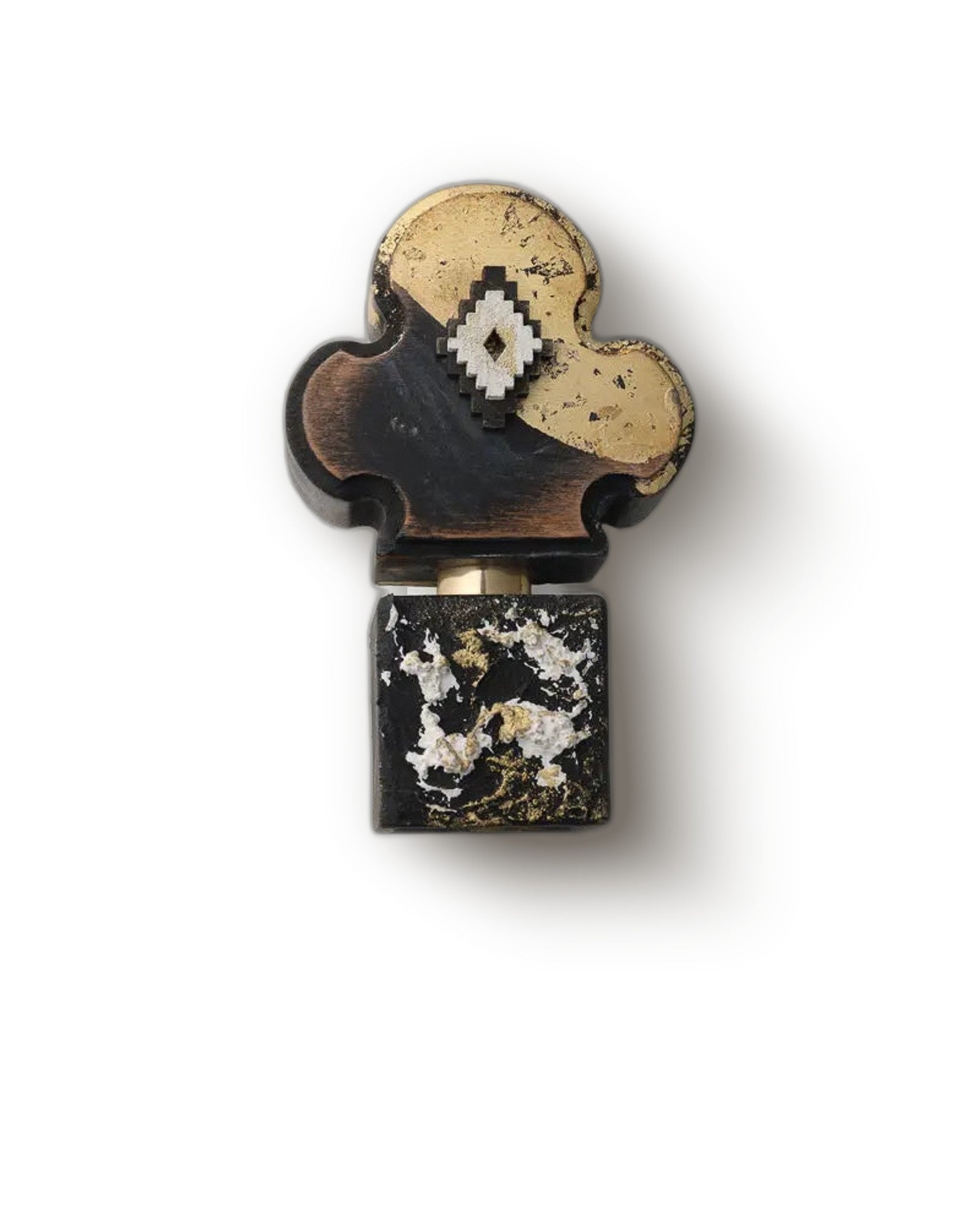Adi Ale Van Diamonitirion Elixir Atonit carved gold-and-wood flacon on a cream backdrop, incense extrait de parfum decant