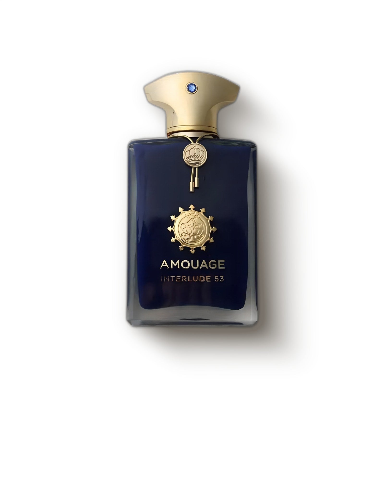 Amouage Interlude 53 deep navy bottle with gold cap on a soft grey backdrop, smoky incense extrait de parfum decant