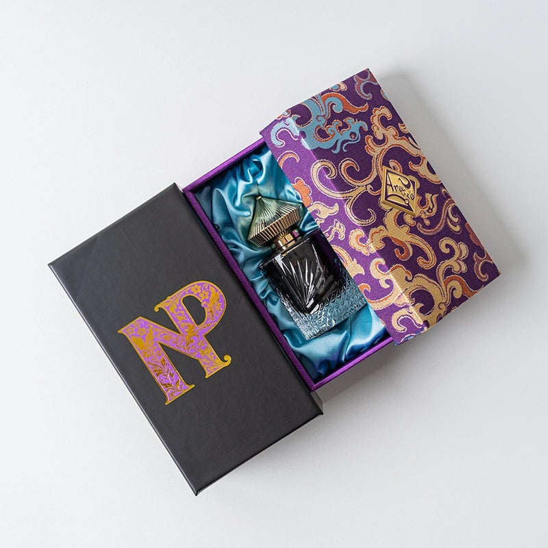 Areej Le Doré Nepalese Patchouli presentation box in purple and teal paisley with the bottle inside