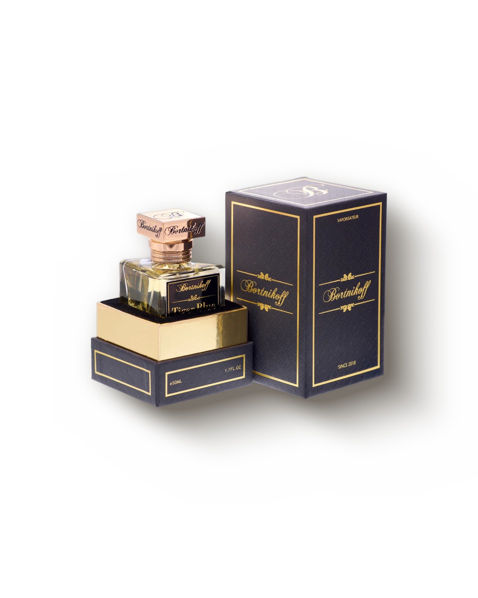 Tiger Blue with its Bortnikoff presentation box, the bottle on the open gold-lined lid beside the closed navy carton