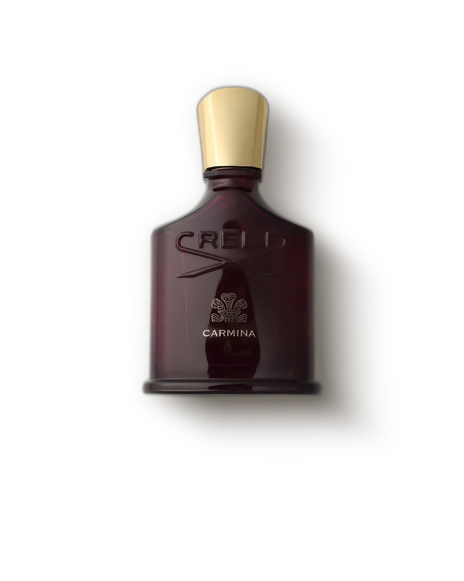 Creed Carmina deep burgundy bottle with gold cap on a soft cream backdrop, fruity floral niche perfume decant