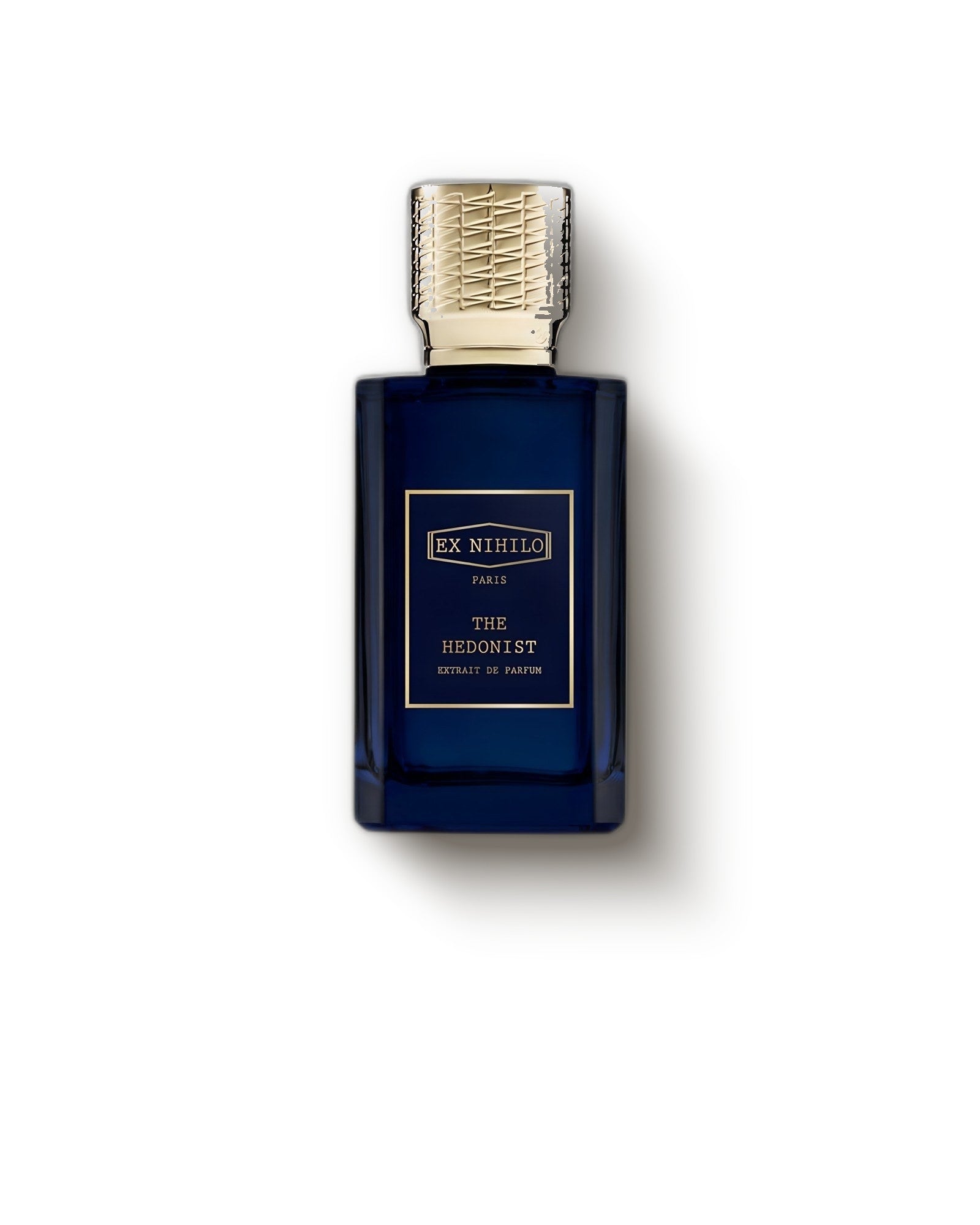 Ex Nihilo The Hedonist deep blue flacon with gold cap on a soft cream backdrop, woody extrait de parfum sample