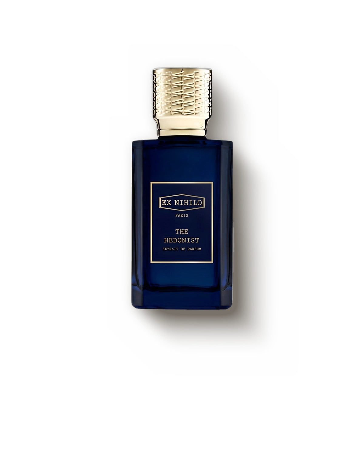 Ex Nihilo The Hedonist deep blue flacon with gold cap on a soft cream backdrop, woody extrait de parfum sample