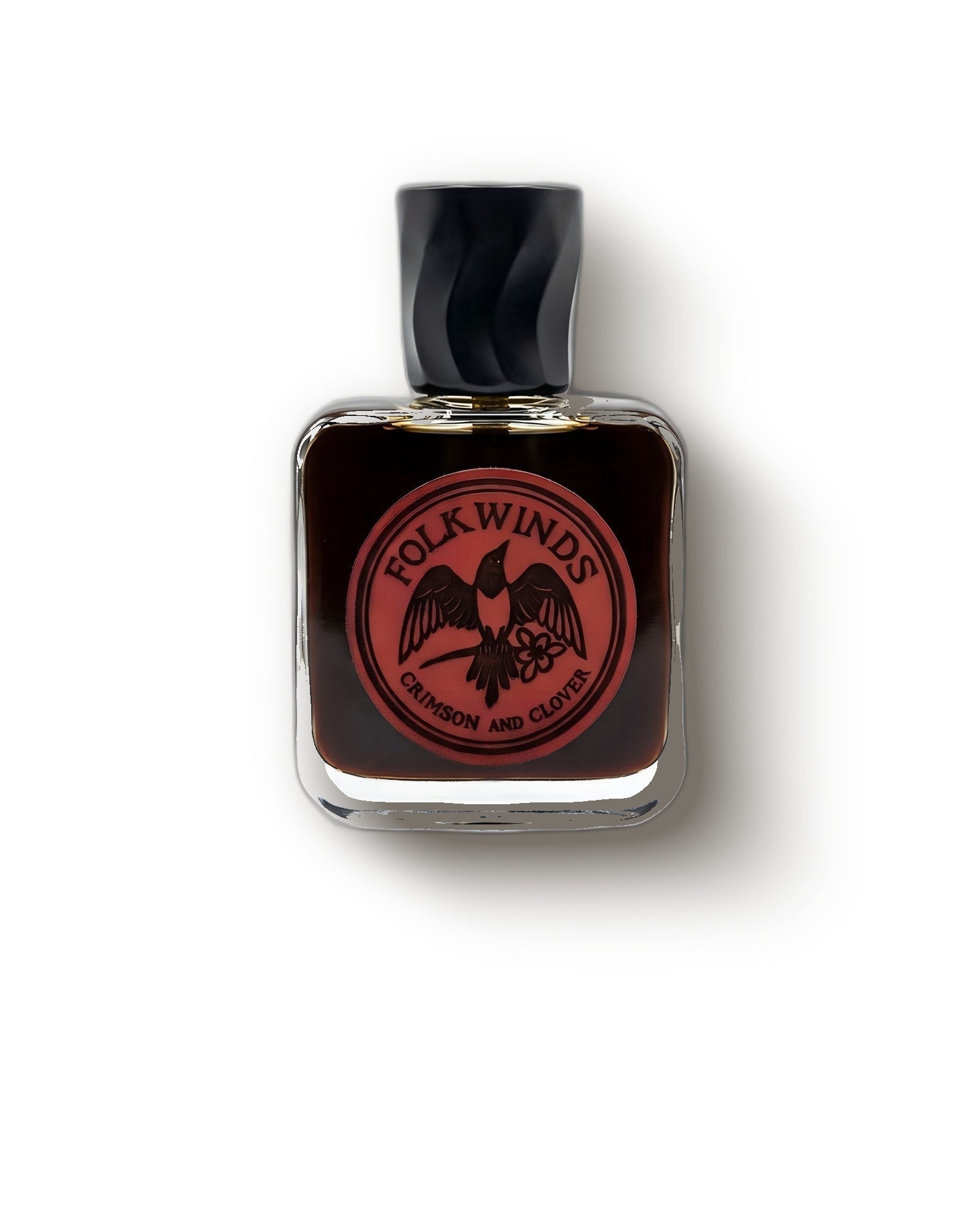 Folkwinds Crimson and Clover bottle with red bird crest on cream, smoky tobacco extrait decant