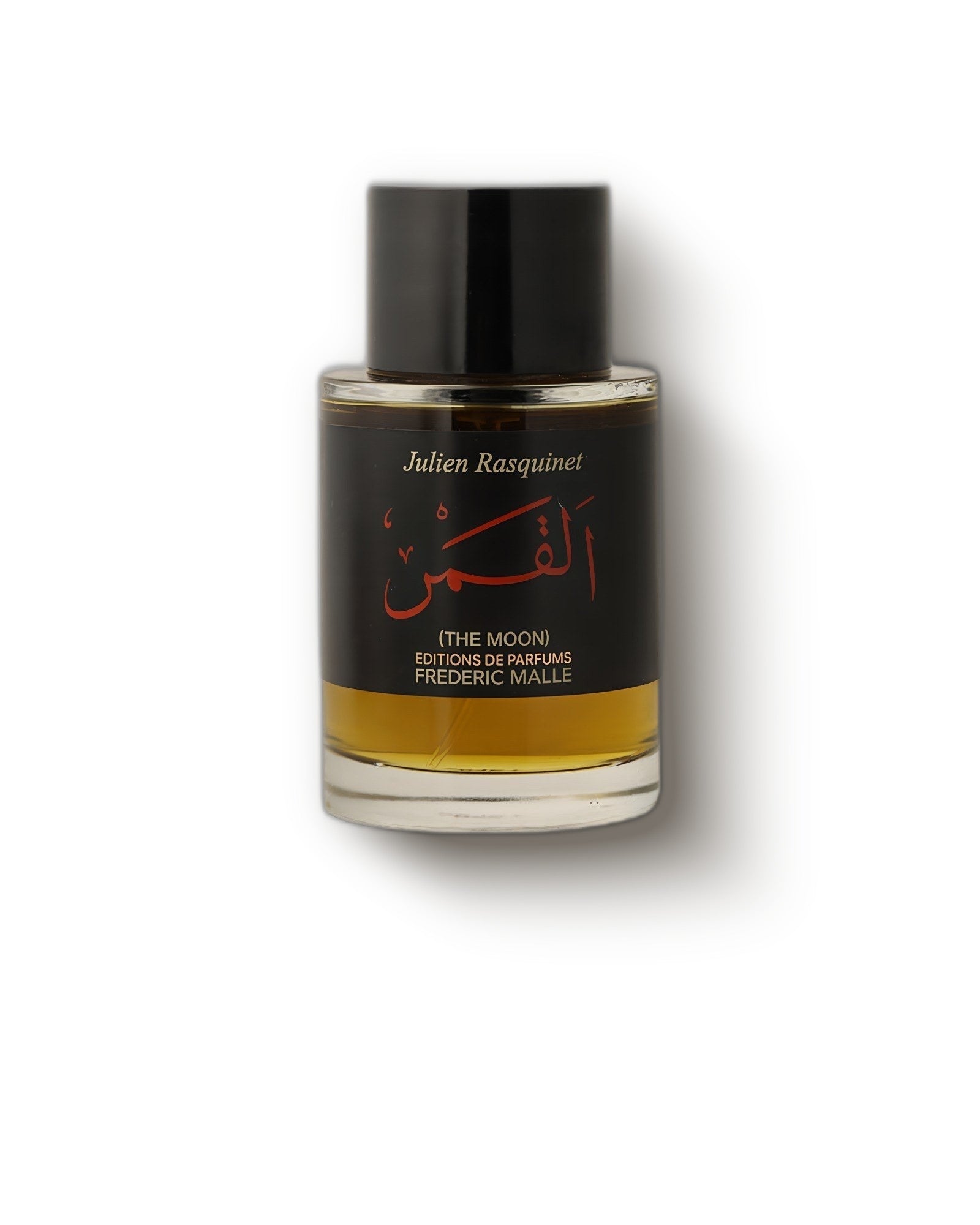 Frederic Malle The Moon bottle with black cap and amber juice on soft cream, rose oud extrait de parfum decant