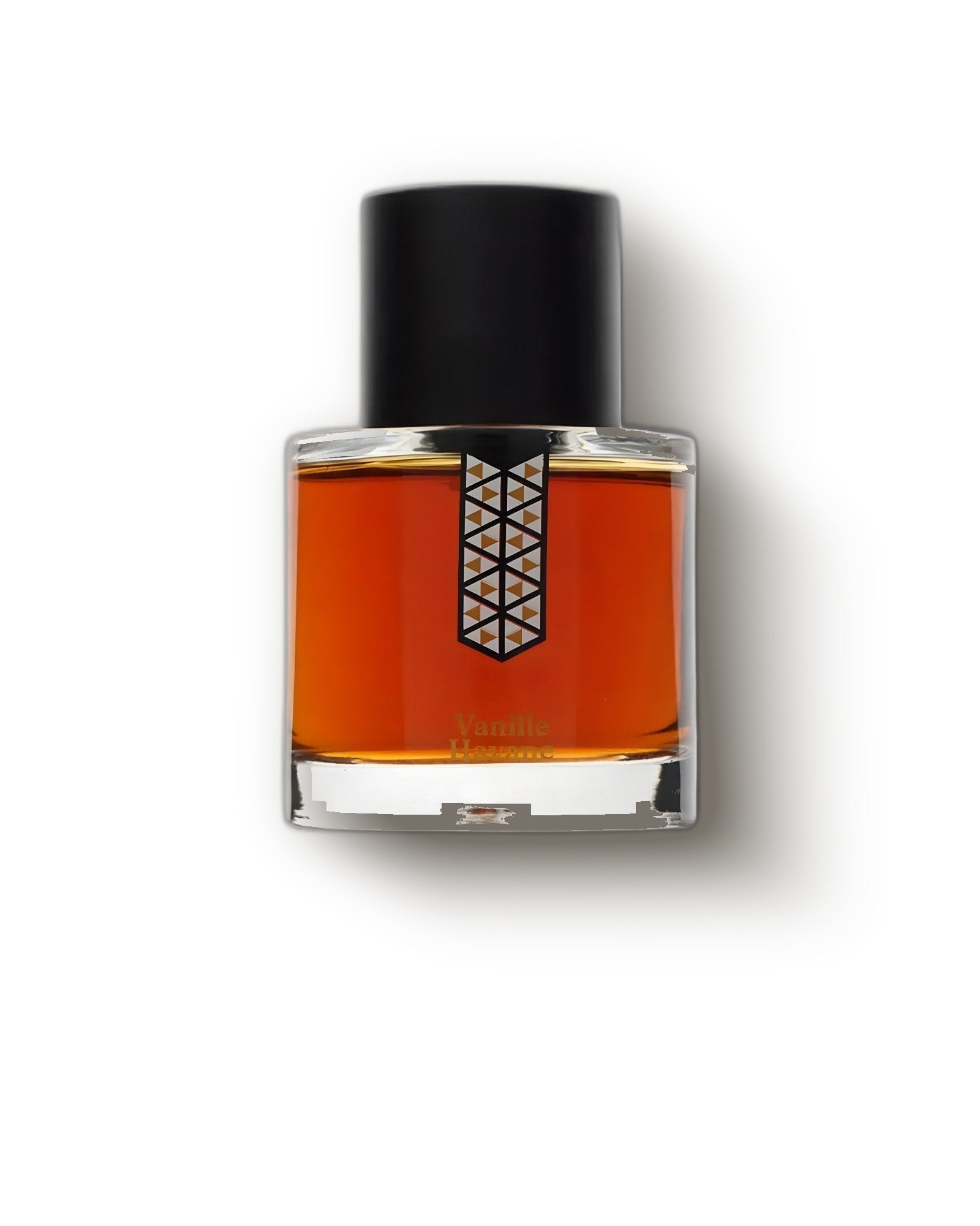 Les Indemodables Vanille Havane amber bottle with black cap on pale cream, tobacco gourmand fragrance decant