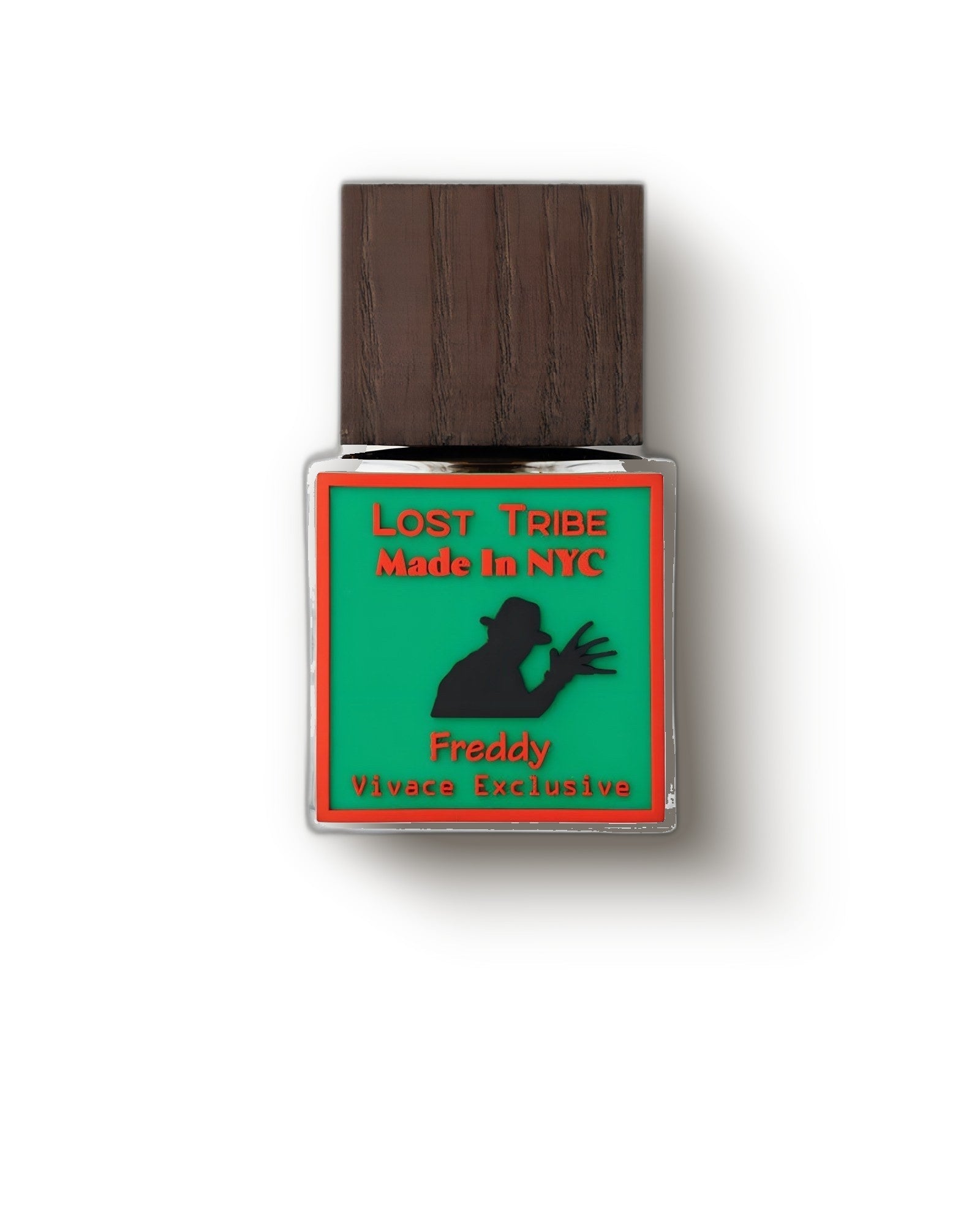 Lost Tribe Freddy wood-capped bottle with green label on a cream studio backdrop, fruity gourmand eau de parfum decant