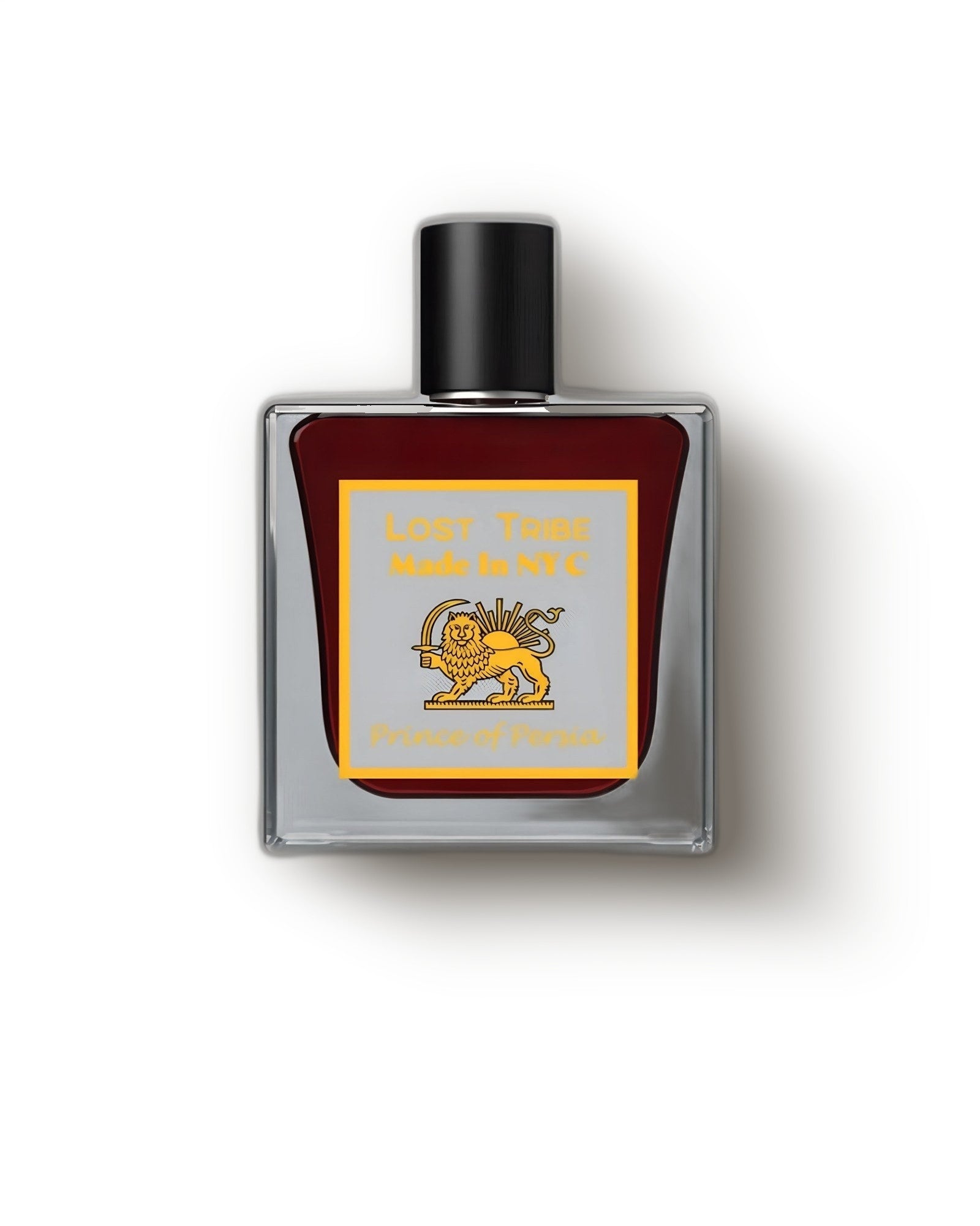 Lost Tribe Prince of Persia bottle of deep red extrait with gold lion-and-sun label on cream, oud rose niche perfume decant