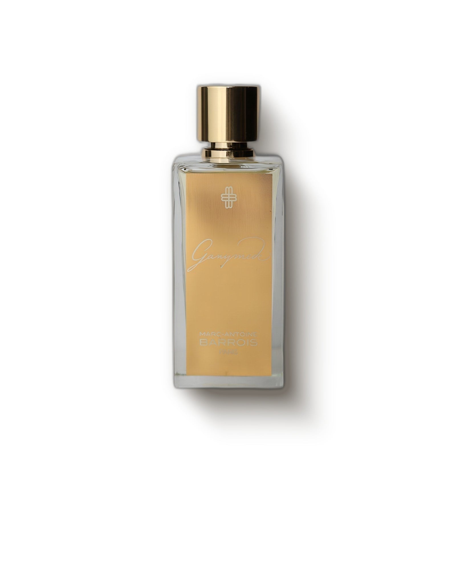 Marc Antoine Barrois Ganymede gold-label bottle on a soft cream backdrop, mineral suede niche perfume decant