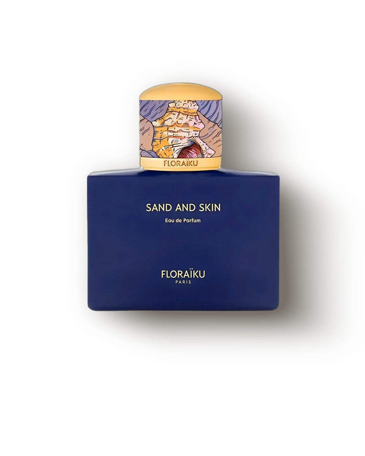 Botol kobalt Floraiku Sand and Skin dengan tutup emas berilustrasi di atas krem, decant parfum niche vanila musky