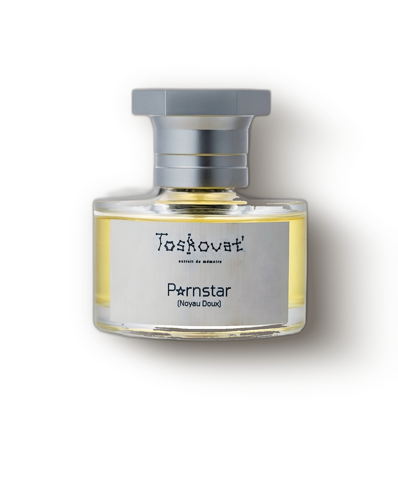 Toskovat Pornstar Noyau Doux bottle with brushed silver cap on cream, gourmand extrait de parfum decant