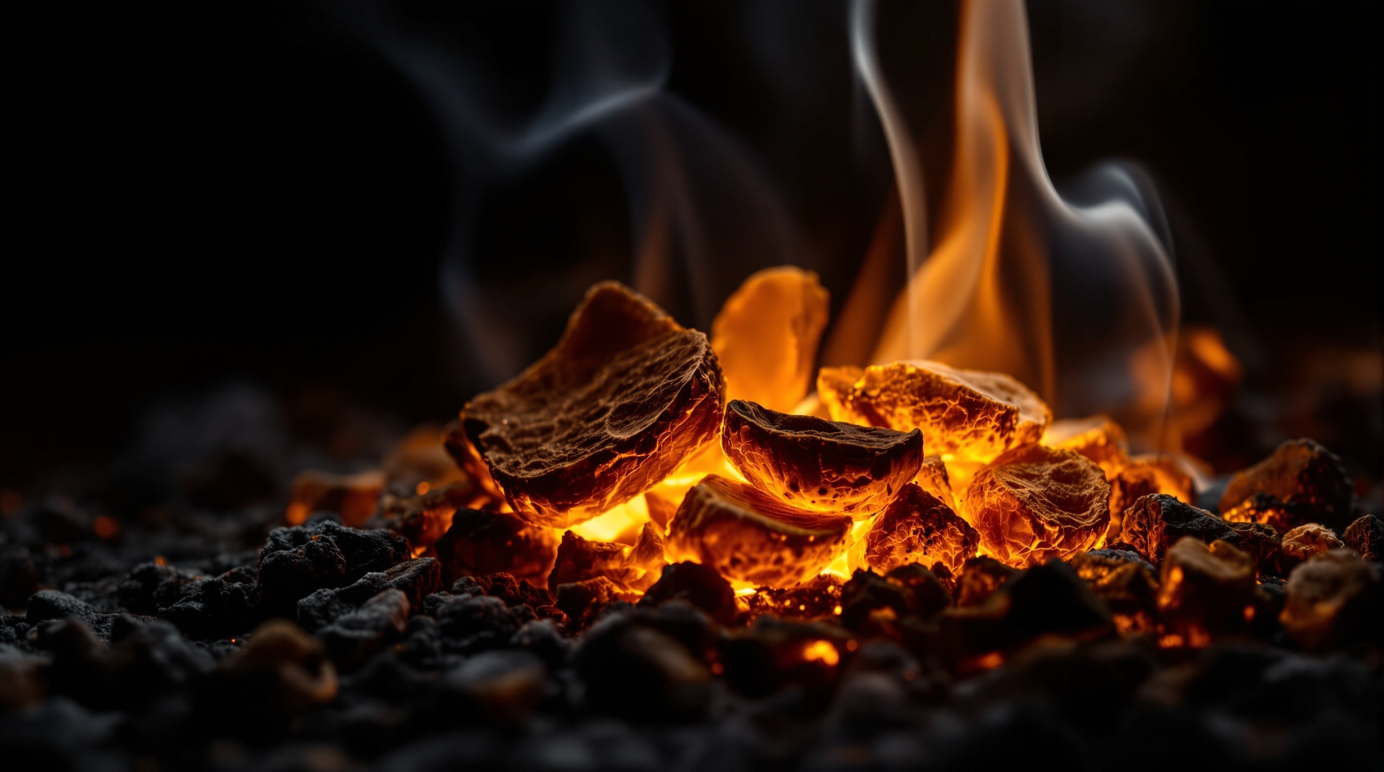 Smouldering oud agarwood embers with curling smoke, evoking the best oud fragrances