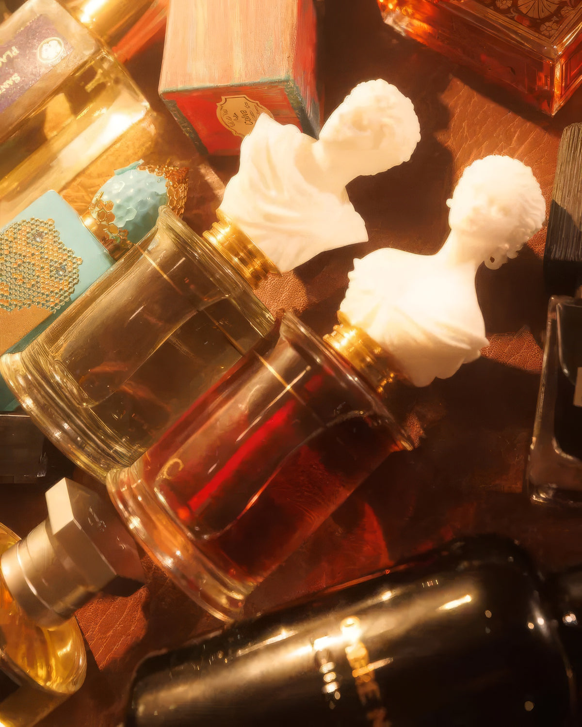 MDCI Invasion Barbare flacon tipped among warm-lit bottles on leather, vanilla fougère fragrance decant