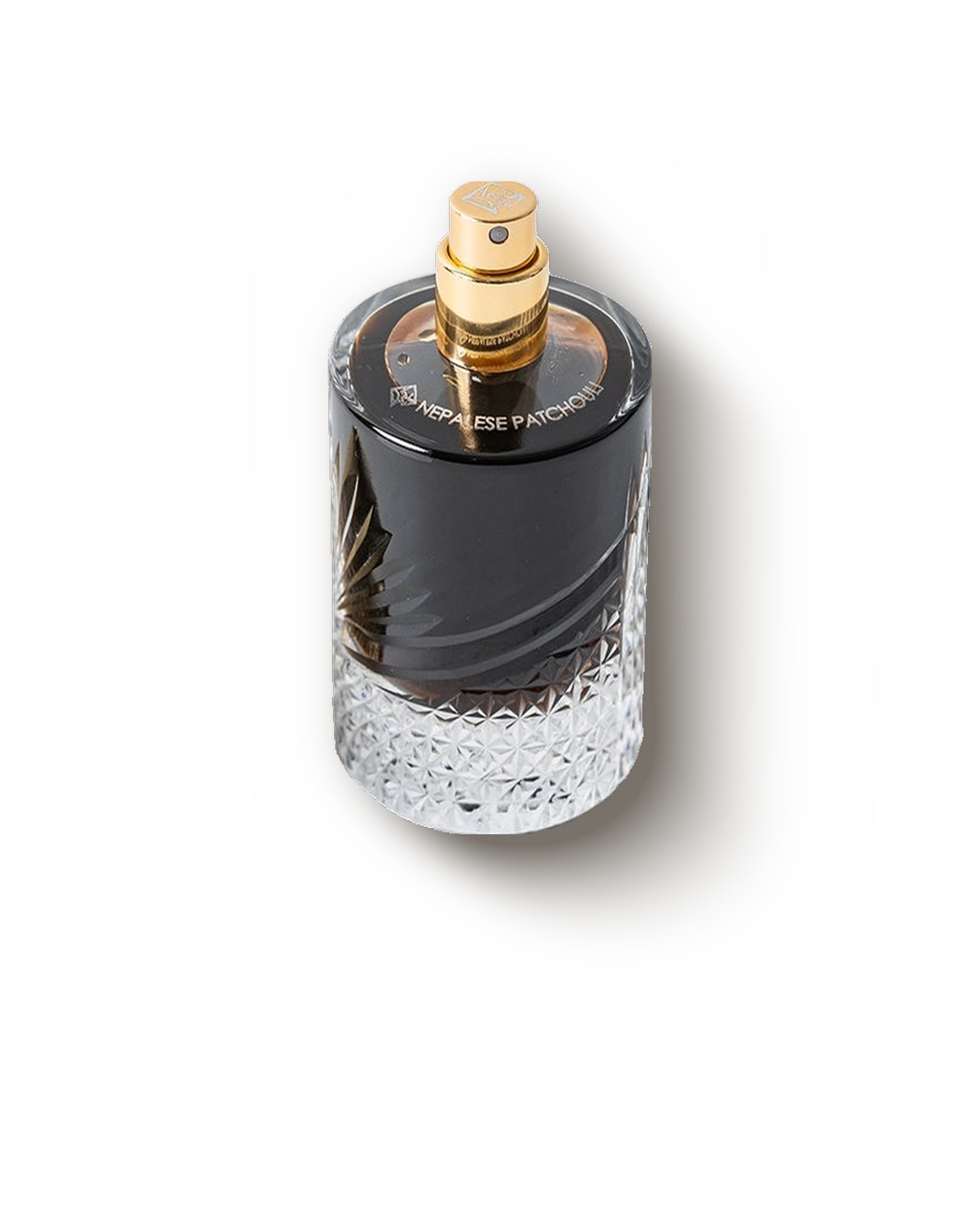 Areej Le Doré Nepalese Patchouli bottle with the gold cap removed showing the atomiser, limited extrait de parfum