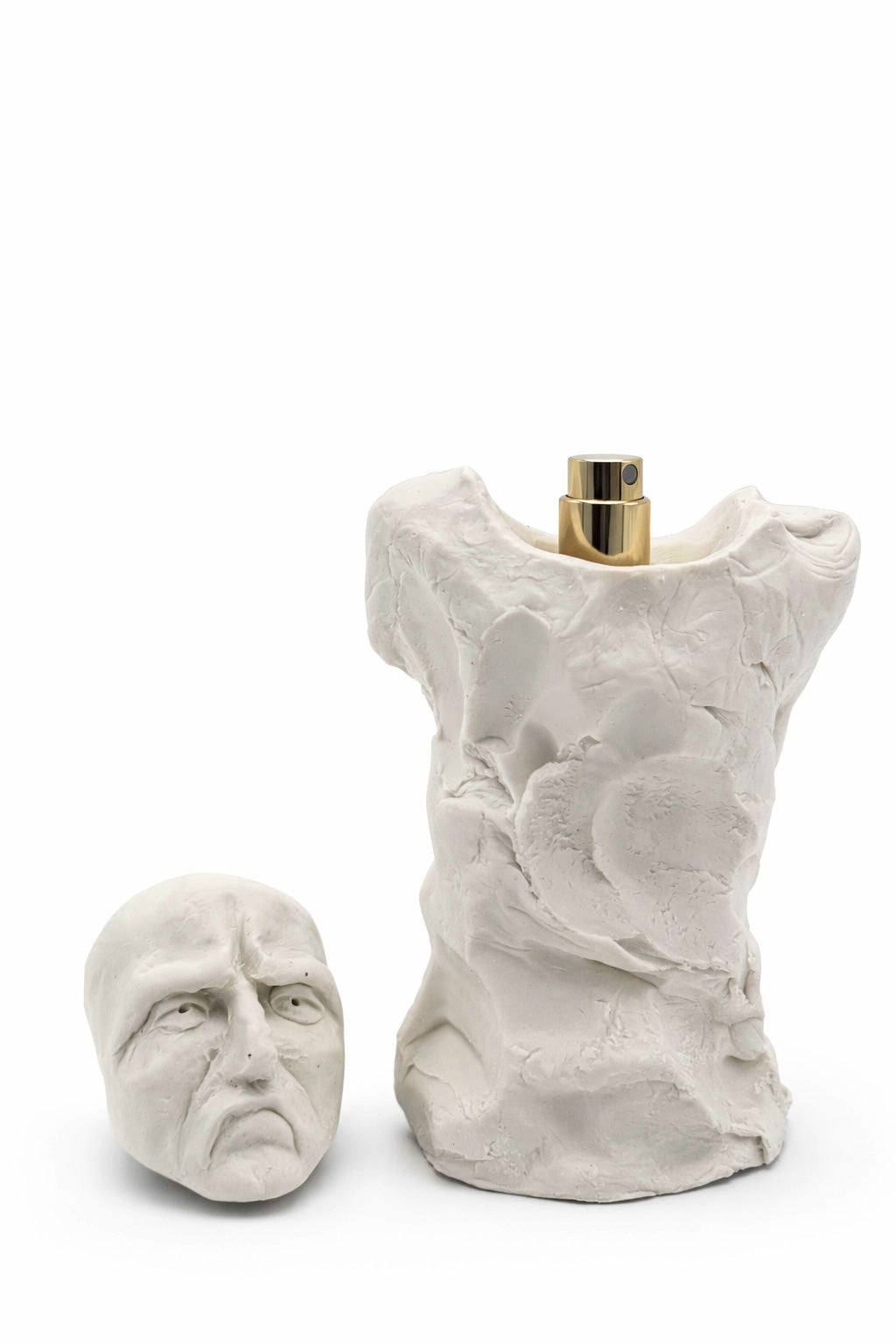 Bidzina Kanchaveli Envy porcelain flacon with the sculpted face lid lifted off, gold atomiser visible, 15ml extrait