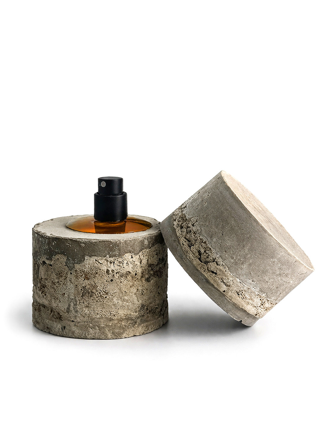 Bidzina Kanchaveli Yellow cast concrete cylinder flacon opened, cast lid resting beside it and the atomiser visible, 30ml eau de parfum