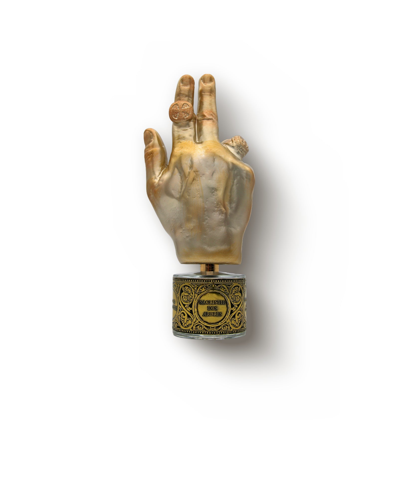 The Sacristie Des Arbres flacon by Filippo Sorcinelli, a 100 ml bottle set in a chased gilt band and stoppered by a gilded hand raised in a blessing gesture.
