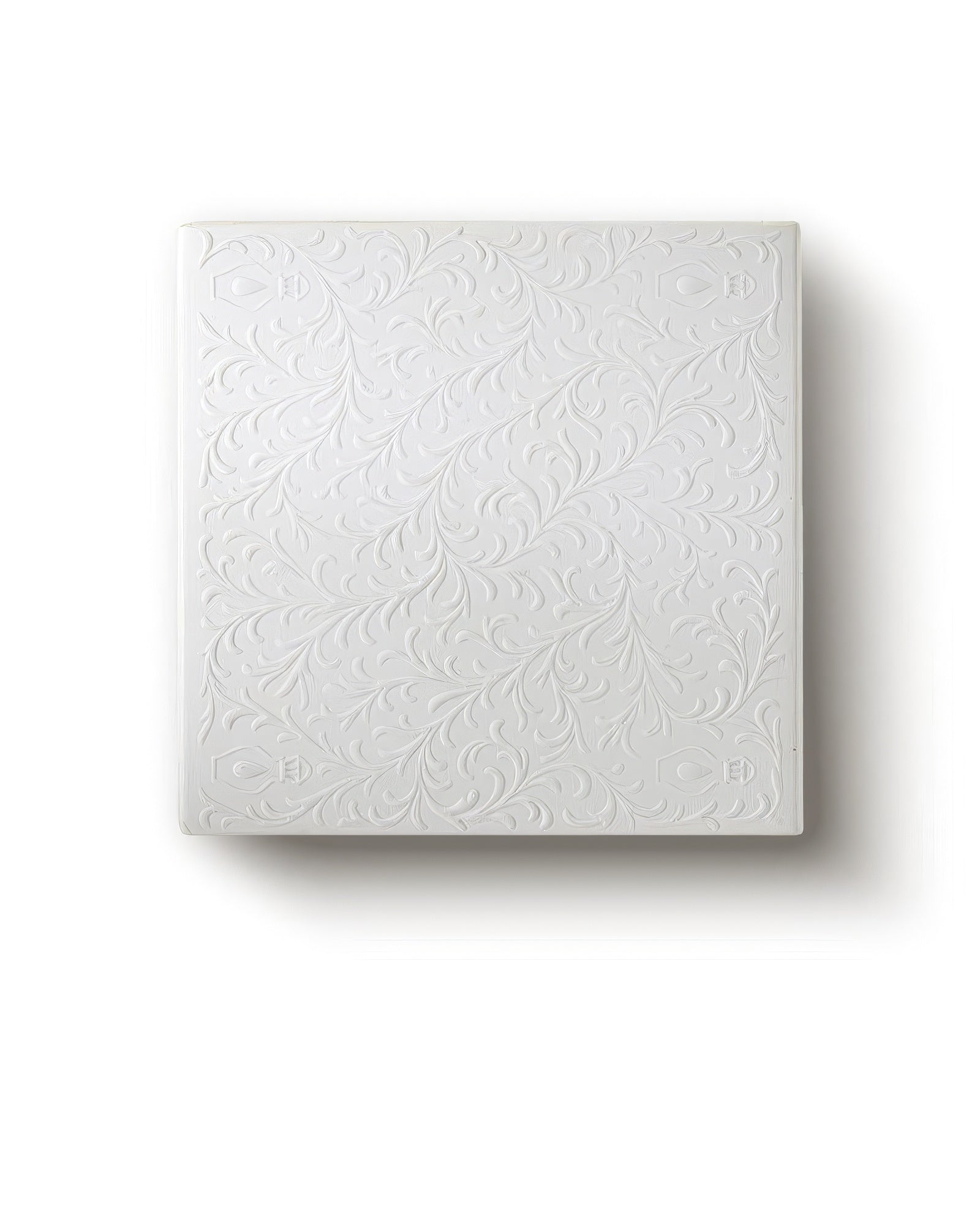 Gouttes Rares curated discovery set in its embossed white box, floral relief lid on a soft cream backdrop