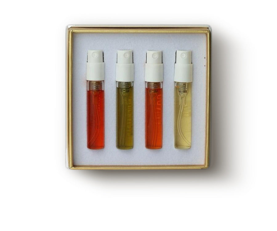 Gold-edged discovery box holding four 2 ml fragrance decants