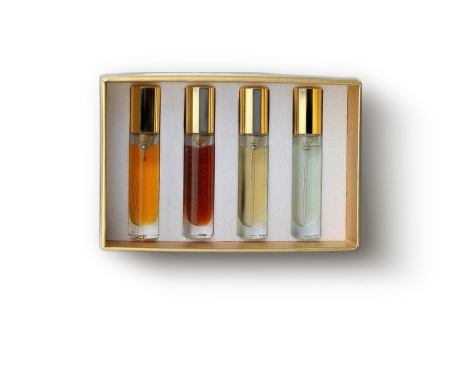 Gold-edged discovery box holding four 5 ml gold-capped fragrance decants